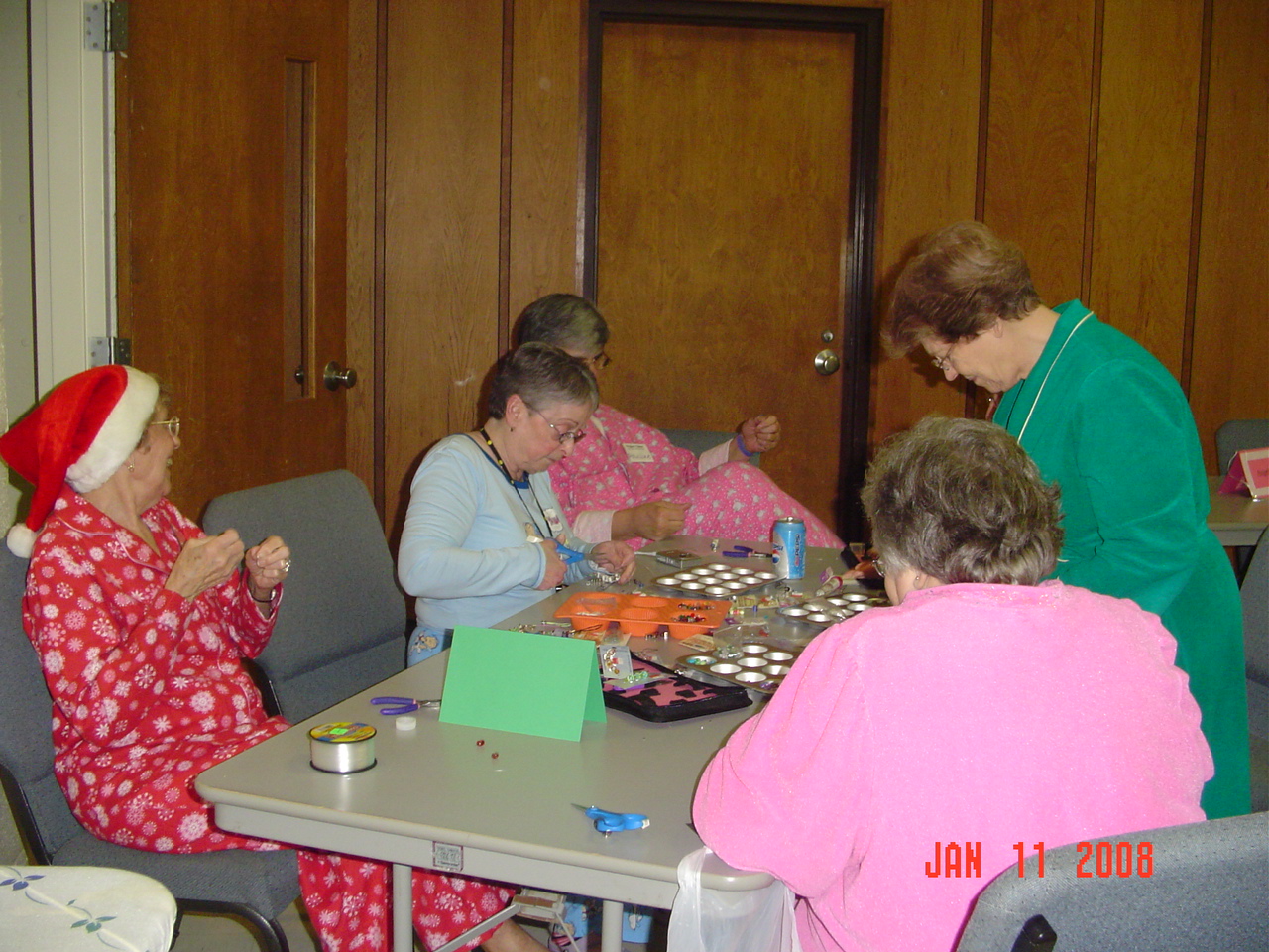 5 women at table